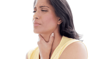 woman touching her throat from pain